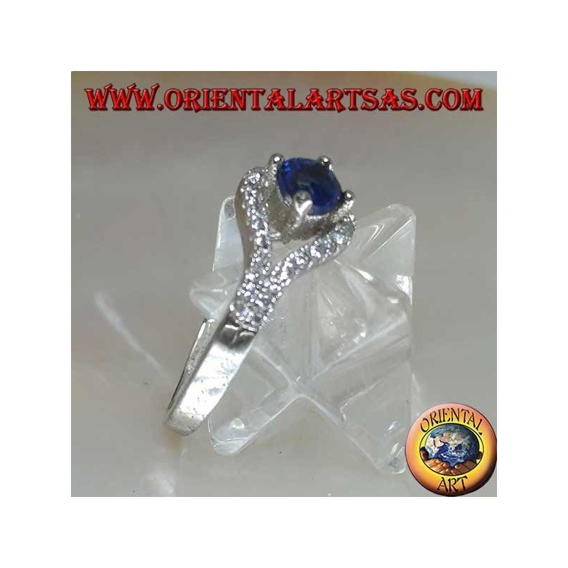 Bague en argent en forme d'oeil avec un saphir synthétique rond et un contour en zircone cubique