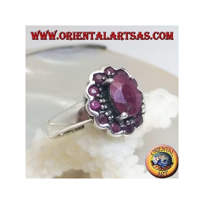 Silver ring with oval natural ruby set surrounded by small round rubies