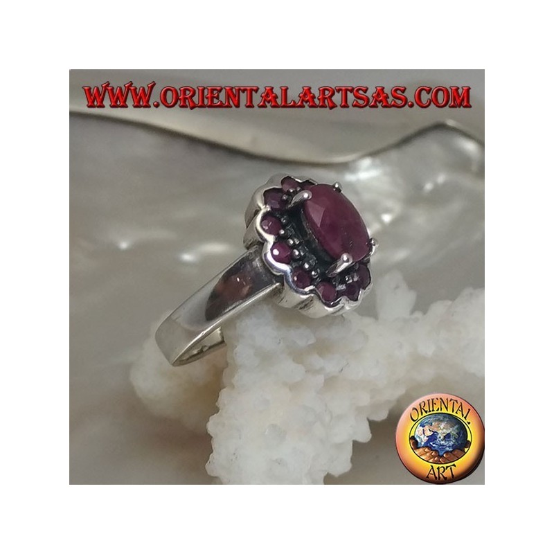 Silver ring with oval natural ruby set surrounded by small round rubies