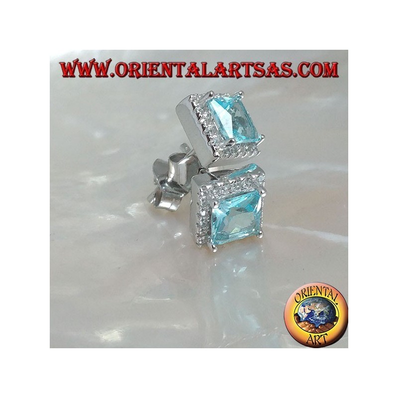 Silver earrings with natural blue topaz set in a square surrounded by zircons