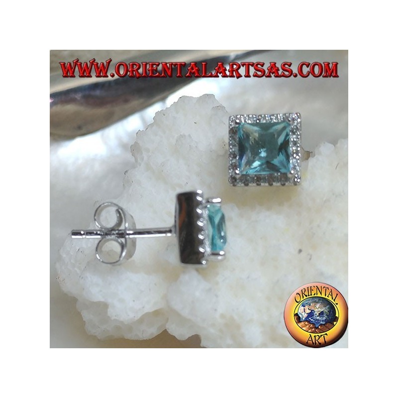 Silver earrings with natural blue topaz set in a square surrounded by zircons
