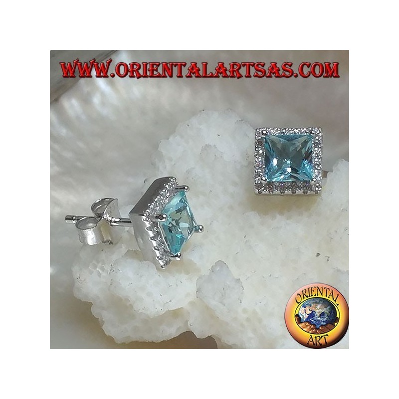 Silver earrings with natural blue topaz set in a square surrounded by zircons