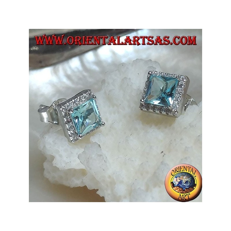Silver earrings with natural blue topaz set in a square surrounded by zircons