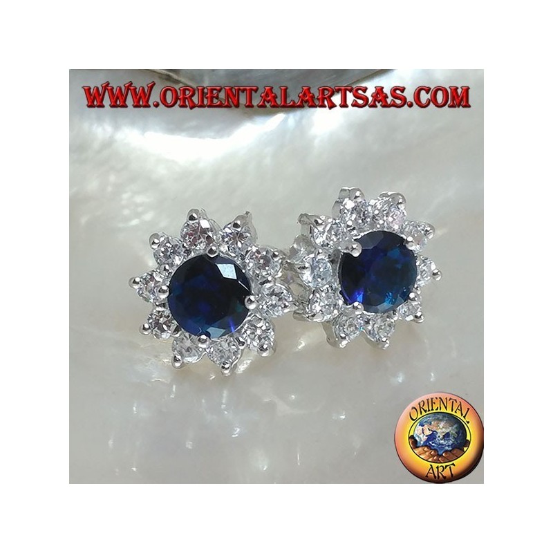 Silver lobe earrings with round synthetic sapphire set surrounded by zircons