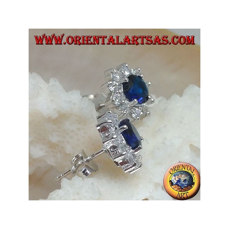Silver lobe earrings with round synthetic sapphire set surrounded by zircons