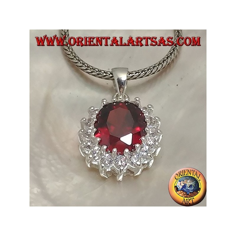 Silver pendant with faceted oval garnet set surrounded by round zircons