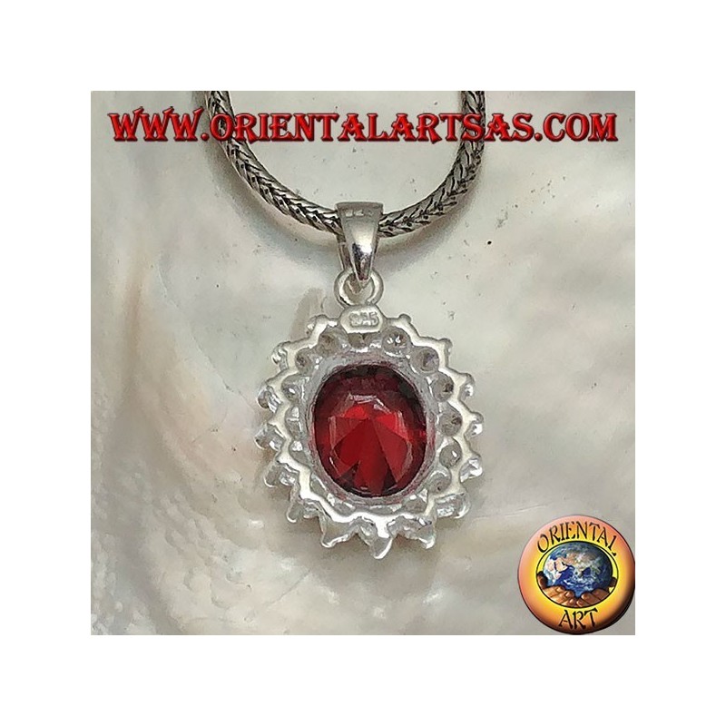 Silver pendant with faceted oval garnet set surrounded by round zircons