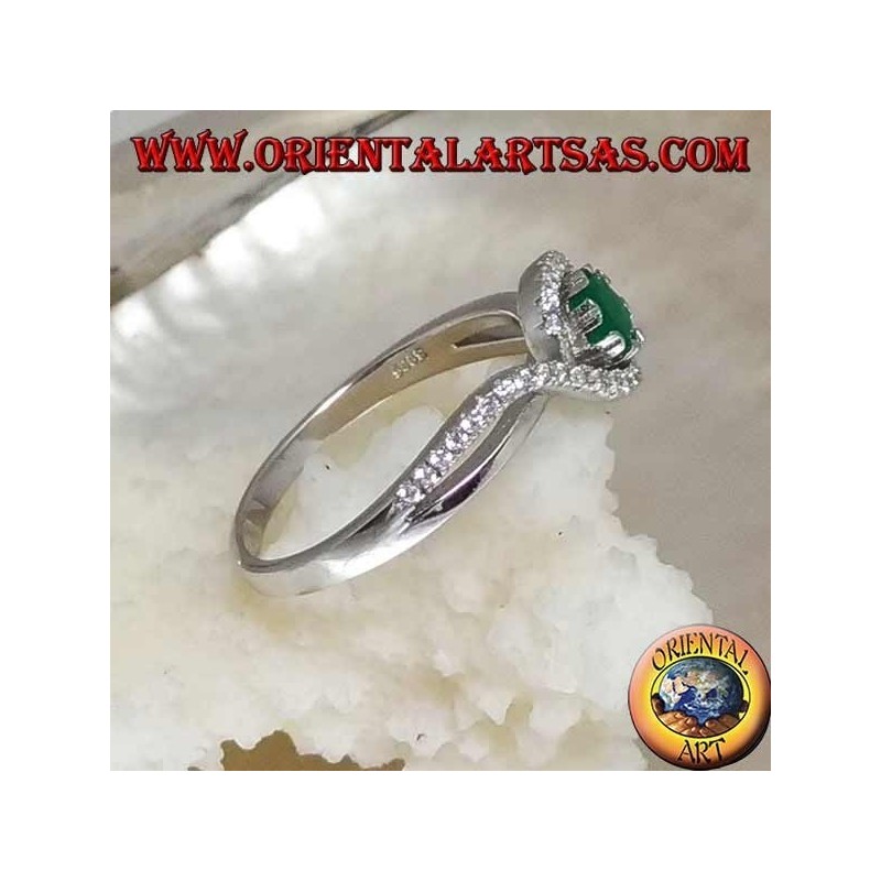 Silver ring with natural round emerald set wrapped in a strip of zircons