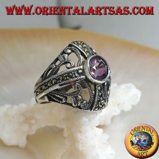 Rounded silver ring with round natural amethyst on a marcasite cross and openwork decorations