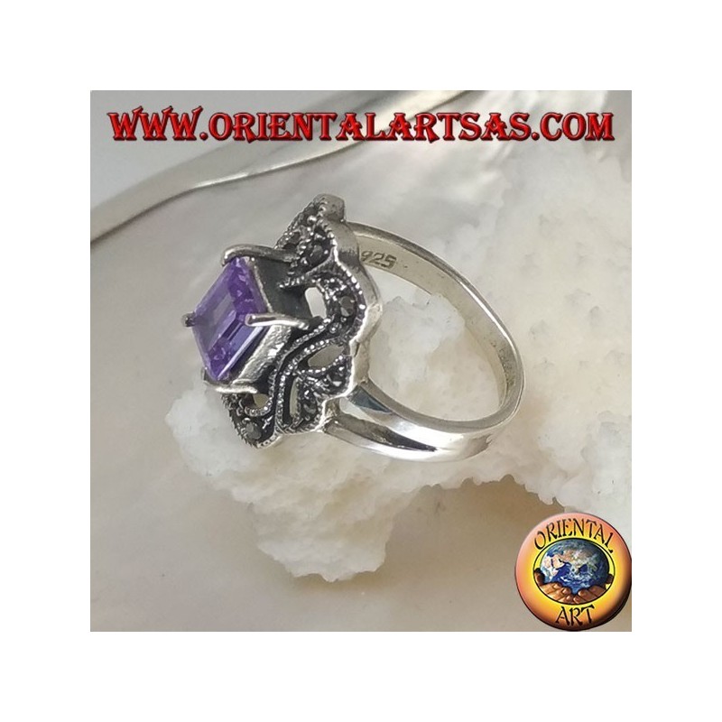 Silver ring with rectangular amethyst colored zircon surrounded by a curved rectangle of marcasite