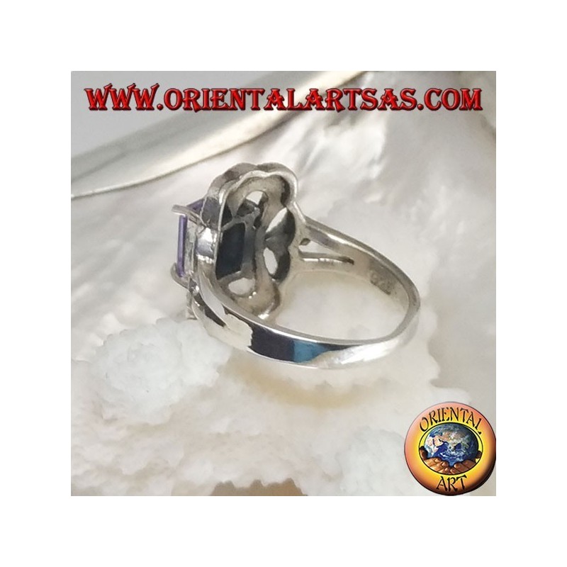 Silver ring with rectangular amethyst colored zircon surrounded by a curved rectangle of marcasite