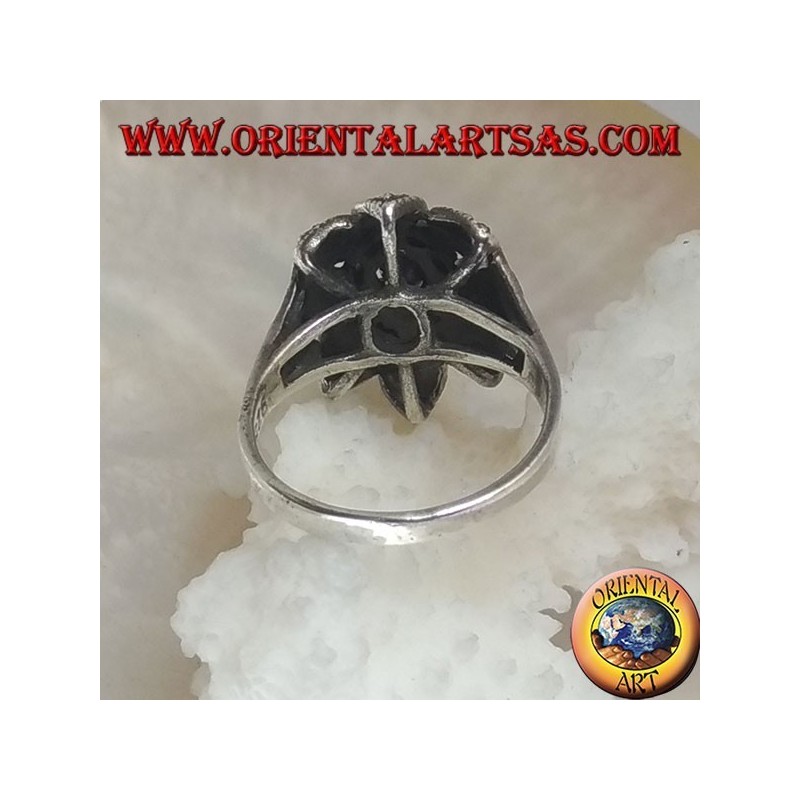 Silver flower ring with central shuttle amethyst-colored zircon and marcasite petals