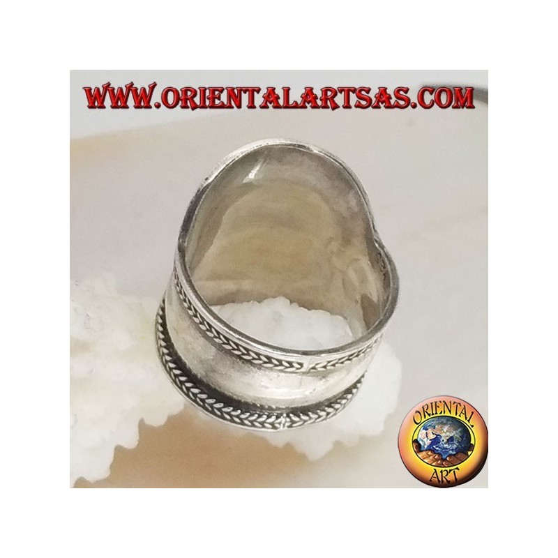 Wide band silver ring with oval garnet and mixed ethnic decorations, Bali