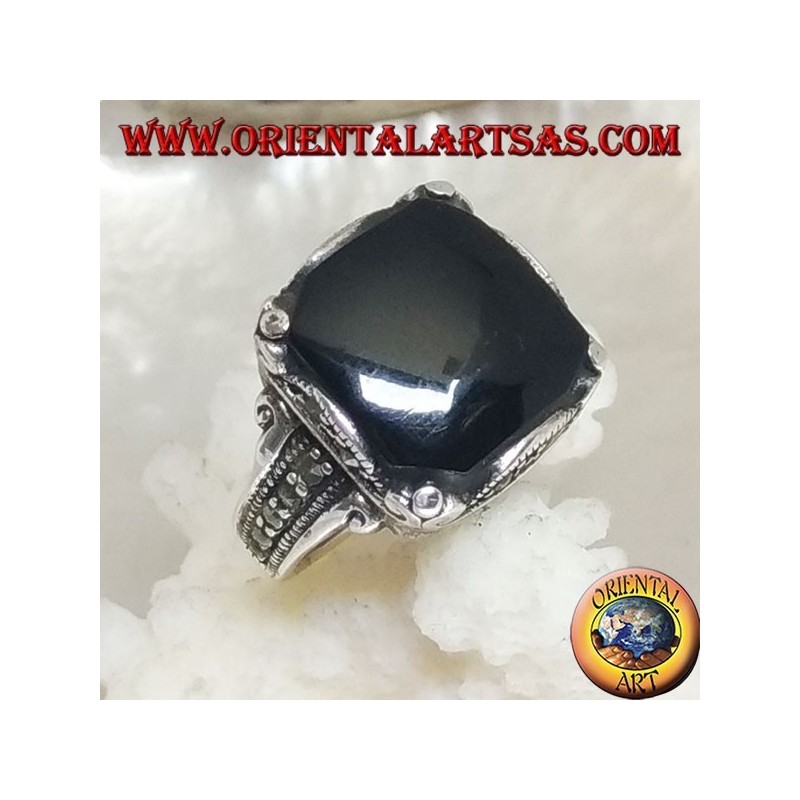 Silver ring with square onyx cabochon in a wavy frame and marcasite around and on the sides