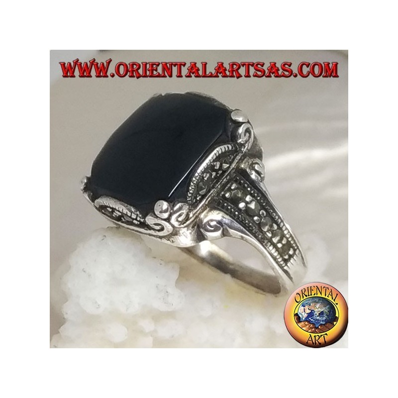Silver ring with square onyx cabochon in a wavy frame and marcasite around and on the sides
