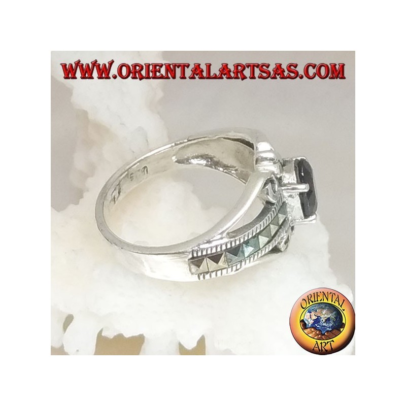 Silver ring set with an oval natural garnet set and a row of square marcasite on the sides