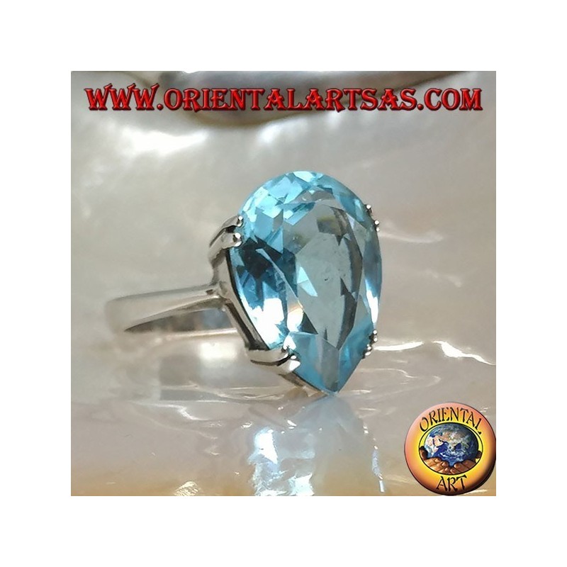 Silver ring with large blue drop topaz set with a claw setting