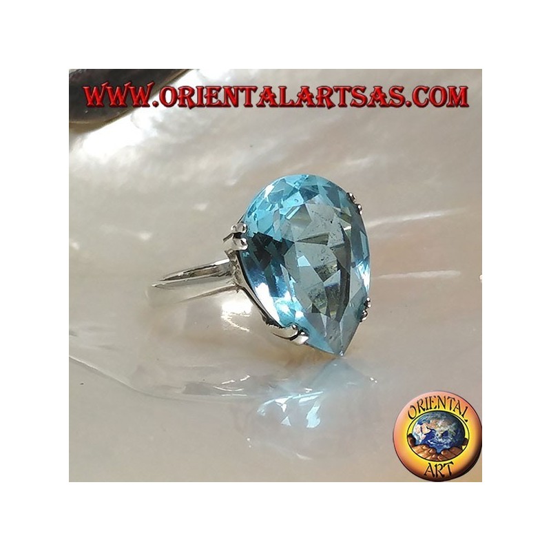 Anillo de plata con topacio azul grande con una garra engastada