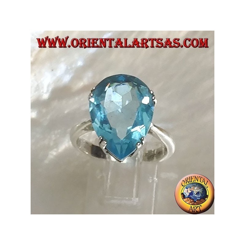 Silver ring with large blue drop topaz set with a claw setting