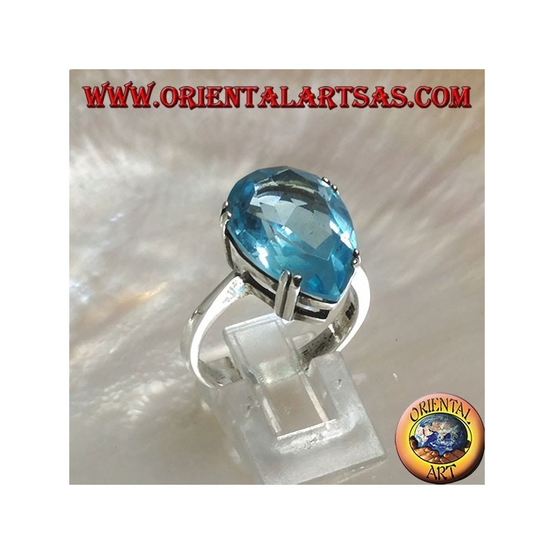Silver ring with large blue drop topaz set with a claw setting