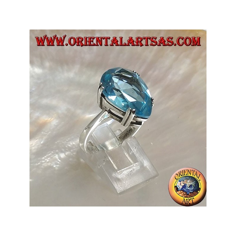 Silver ring with large blue drop topaz set with a claw setting