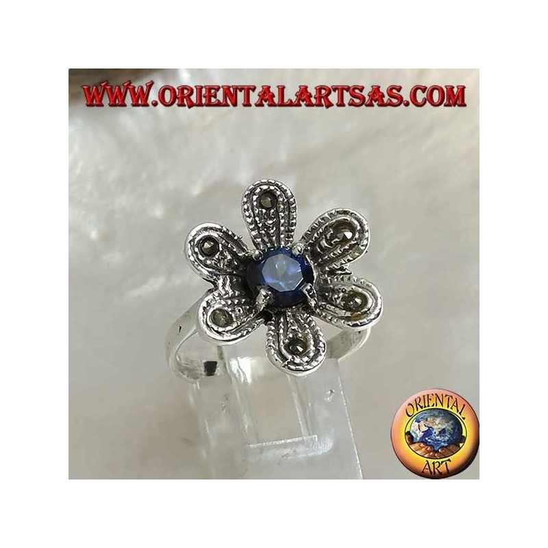 Anillo de plata en forma de flor "estrella de Belén" con zafiro redondo y circonita de marcasita