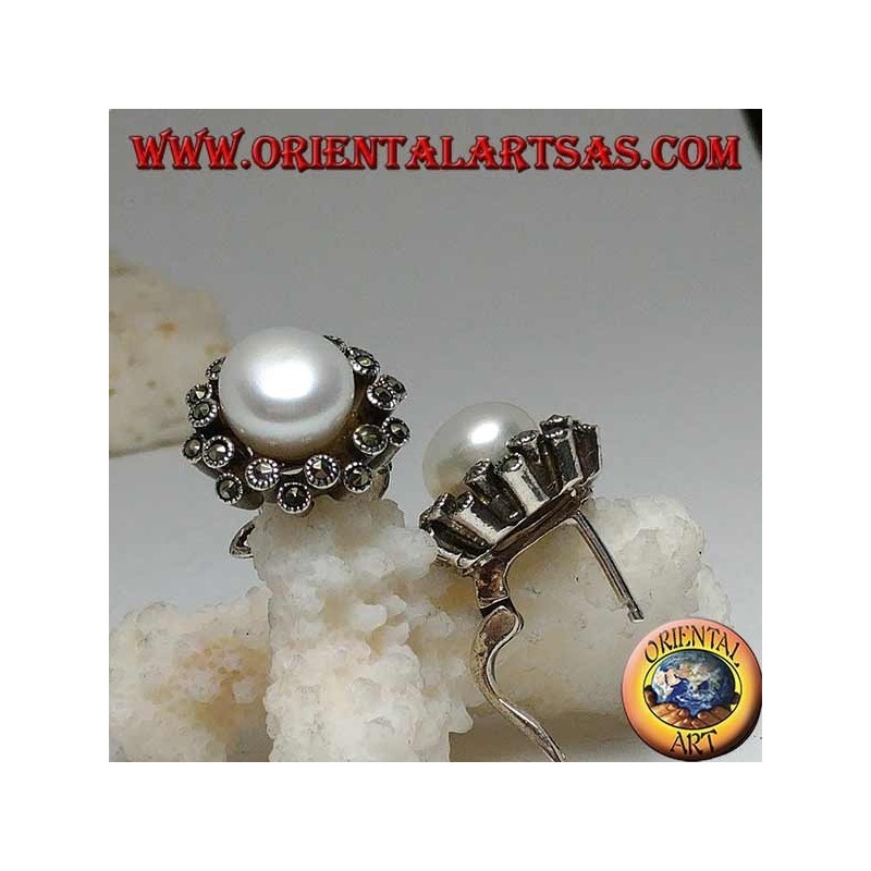Lever-lock silver earrings with freshwater pearl surrounded by two alternating lines of marcasite