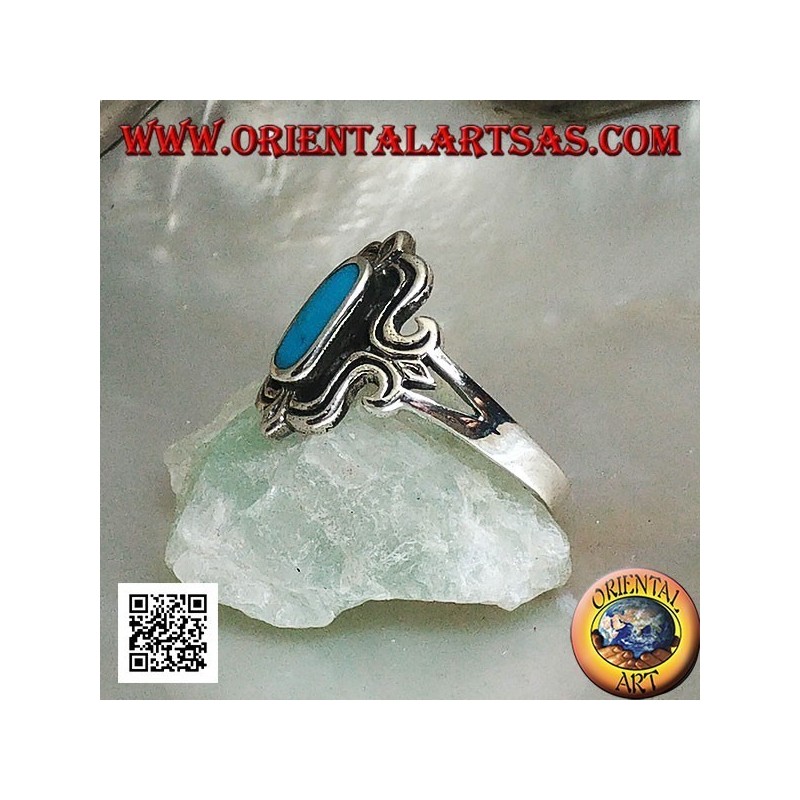 Silver ring with oval turquoise elongated in a stylized rectangle