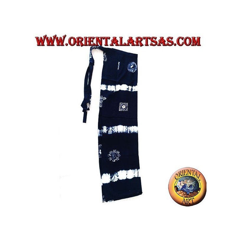 Long blue unisex pantapareo with white designs of horizontal bands and stylized suns