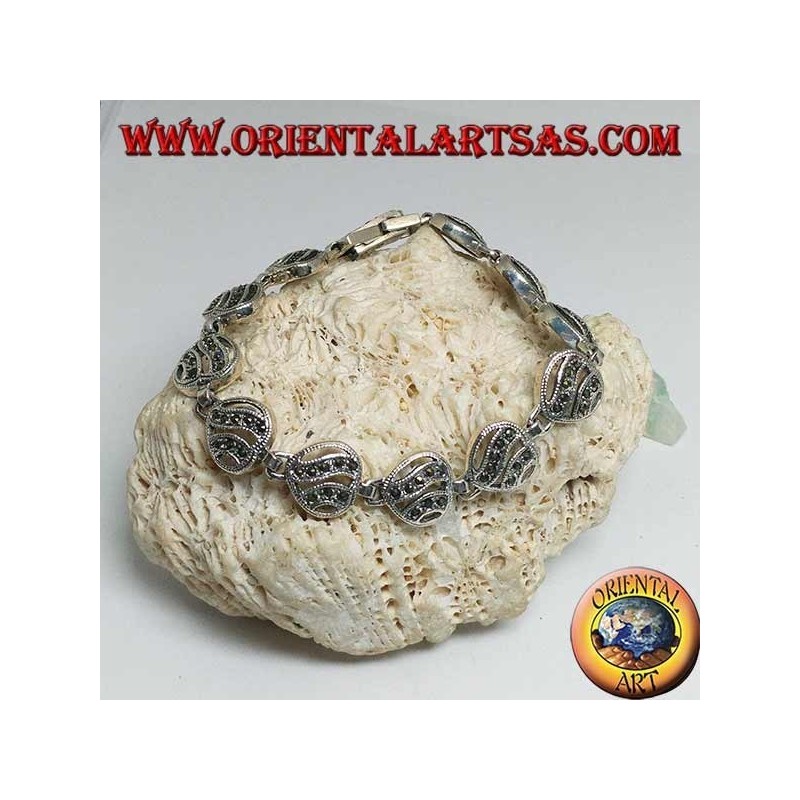 Silver bracelet with 11 openwork hearts with two wavy lines studded with marcasite
