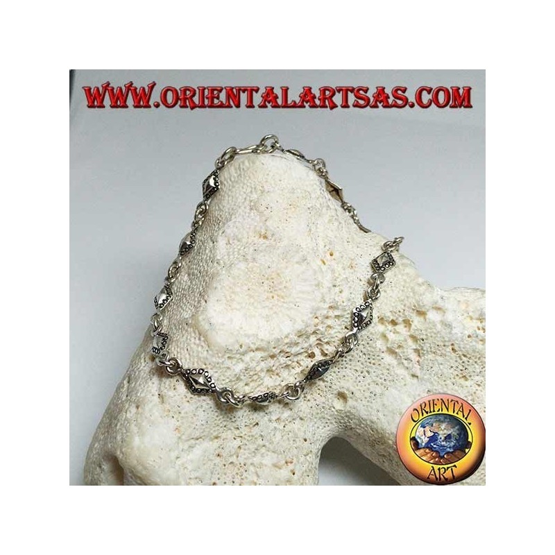 Soft silver bracelet with rhomboid plates with dotted outlines