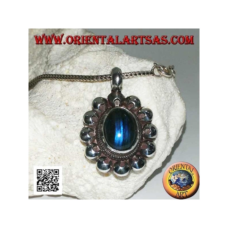Silver pendant with oval blue fluorescent labradorite cabochon surrounded by perforated discs