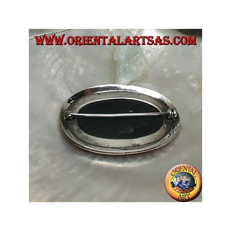 Silver brooch with large oval onyx surrounded by triangles and balls decoration