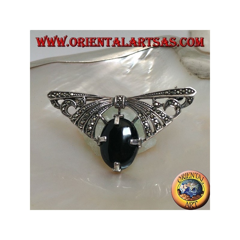 Broche en argent en forme d'arc clouté de marcassite avec onyx ovale serti dessous