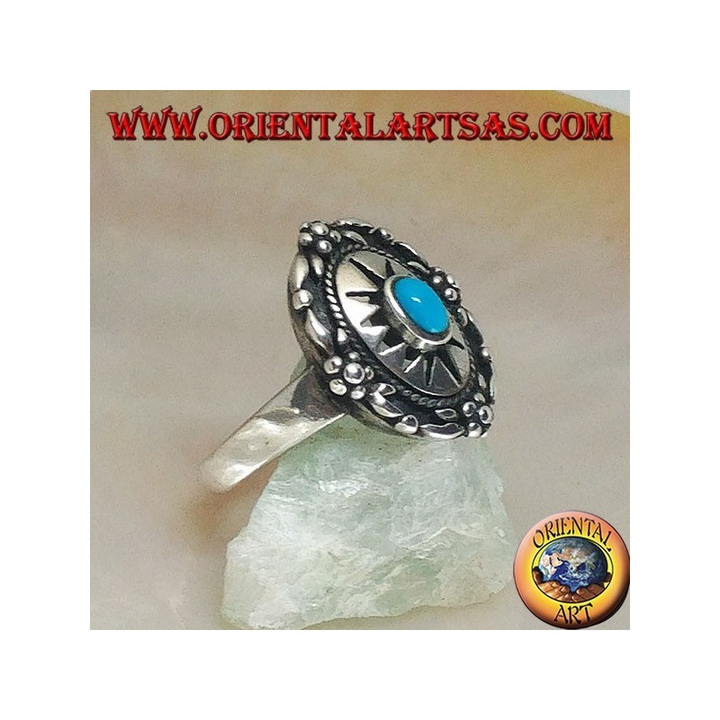 Shield silver ring decorated with central oval turquoise on engraved sun and flowers on the edge