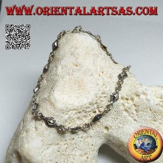 Soft silver bracelet with rhomboid plates with dotted outlines