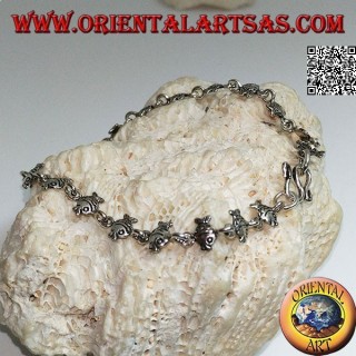 Soft silver bracelet with row of goldfish