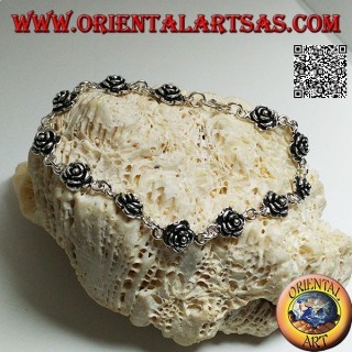 Soft silver chain bracelet with row of roses with plate underneath