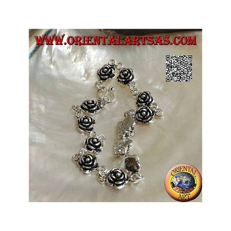 Soft silver chain bracelet with row of roses with plate underneath
