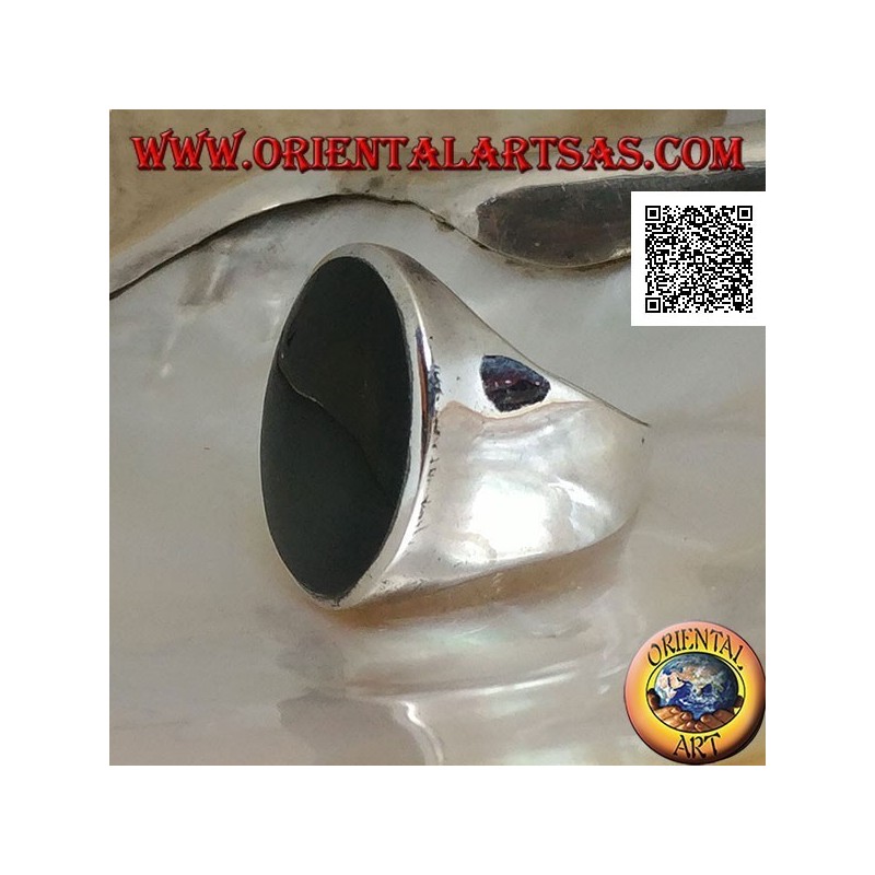 Silver ring with large flat round onyx on a smooth frame slightly concave on the sides