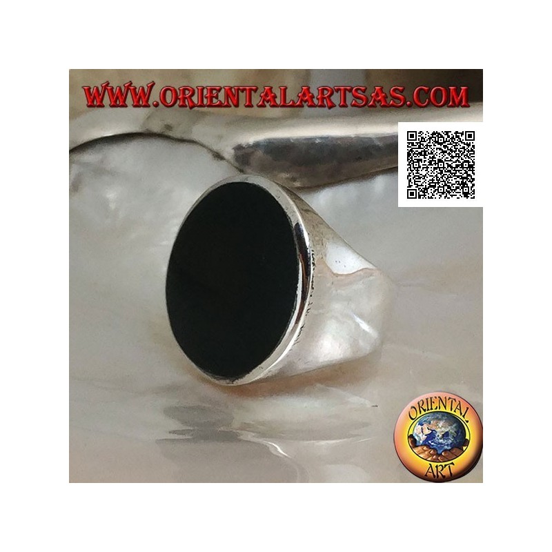 Silver ring with large flat round onyx on a smooth frame slightly concave on the sides