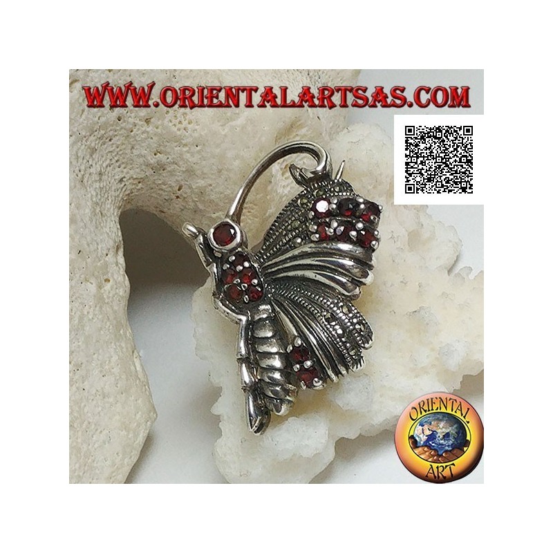 Broche en argent en forme de papillon de profil parsemé de marcassite et de grenats