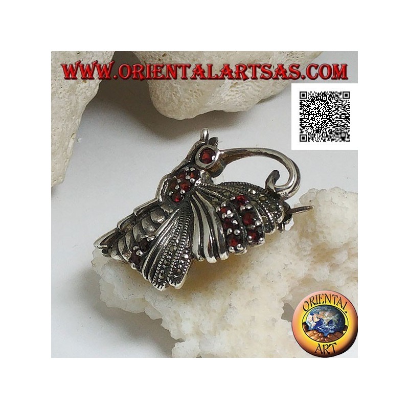 Silver brooch in the shape of a butterfly in profile studded with marcasite and garnets