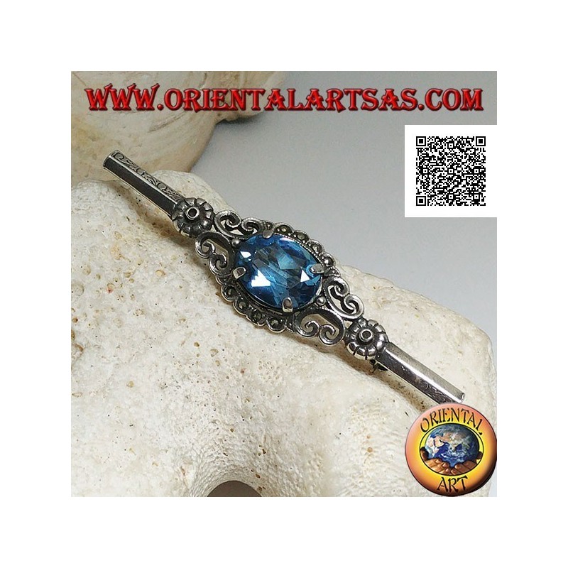 Broche de plata con conjunto de topacio azul rodeado de decoración imperial con marcasita en un palo