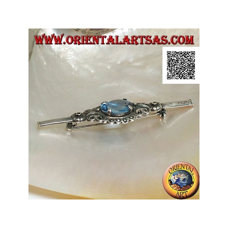 Broche de plata con conjunto de topacio azul rodeado de decoración imperial con marcasita en un palo