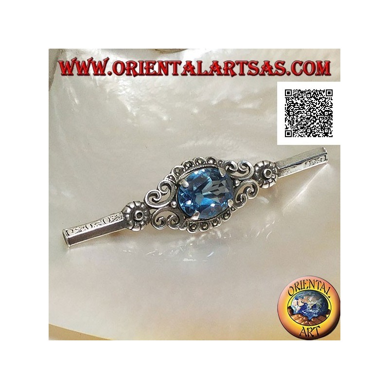 Broche de plata con conjunto de topacio azul rodeado de decoración imperial con marcasita en un palo