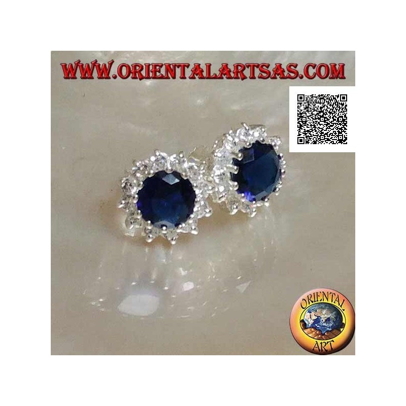 Silver earrings with round sapphire-colored zircon surrounded by white zircons