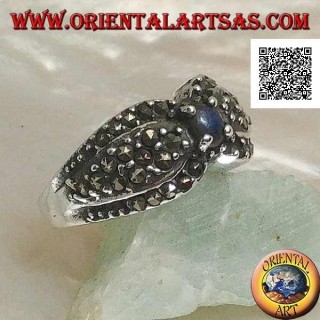 Silver ring with natural round lapis lazuli in the center between two drops studded with marcasite