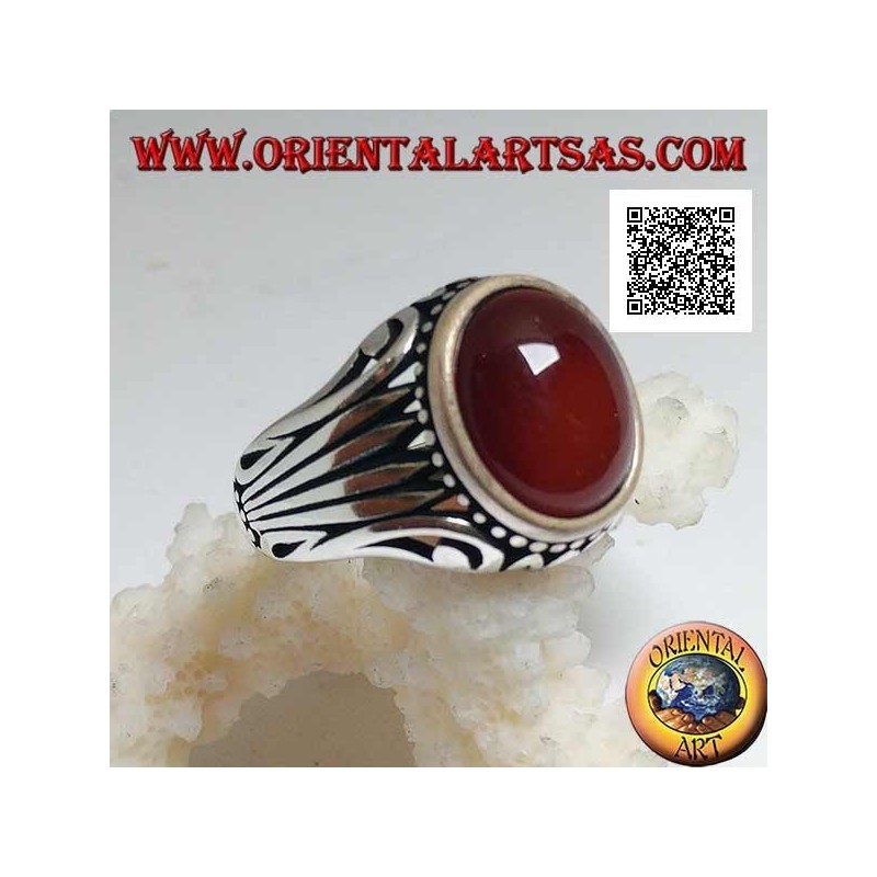 Silver ring with oval cabochon carnelian surrounded by dots and stripes engraved on the sides
