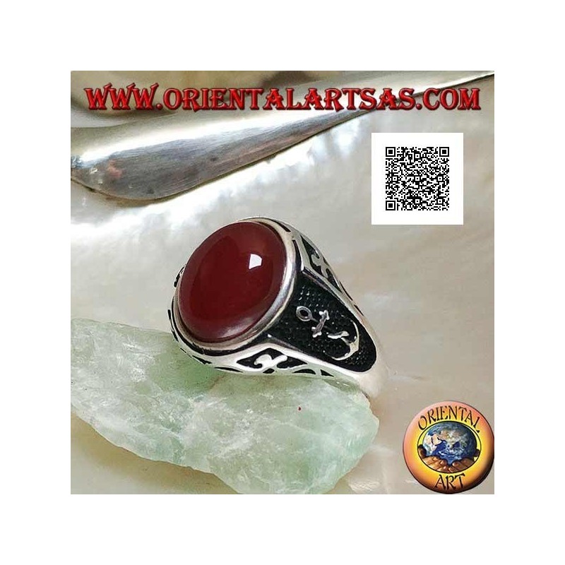 Silver ring with oval cabochon carnelian with engravings and still in relief on the sides
